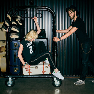 Guests riding the luggage cart in Hotel Zeppelin